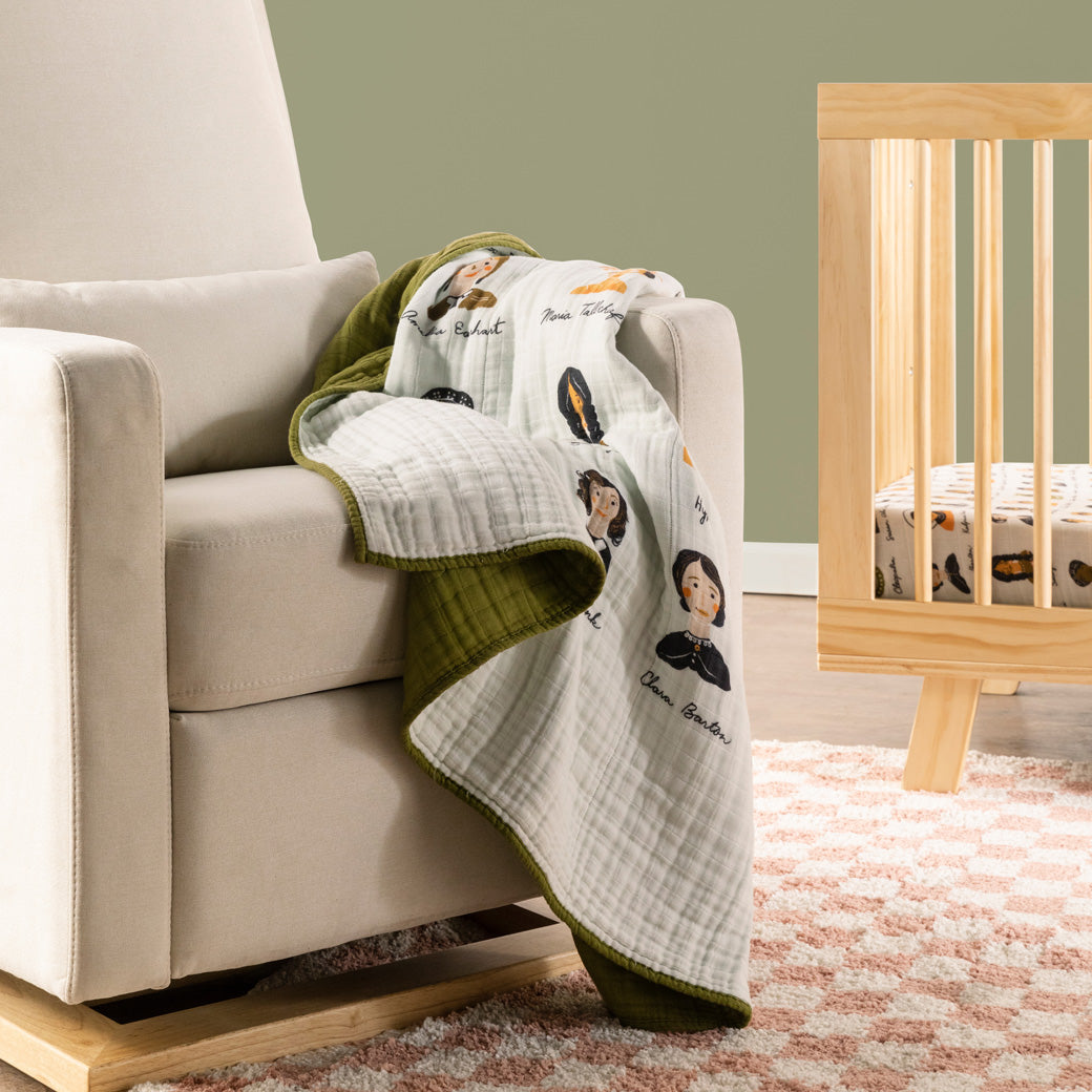 Babyletto's Quilt In 3-Layer GOTS Certified Organic Muslin Cotton on a recliner in -- Color_Women In History