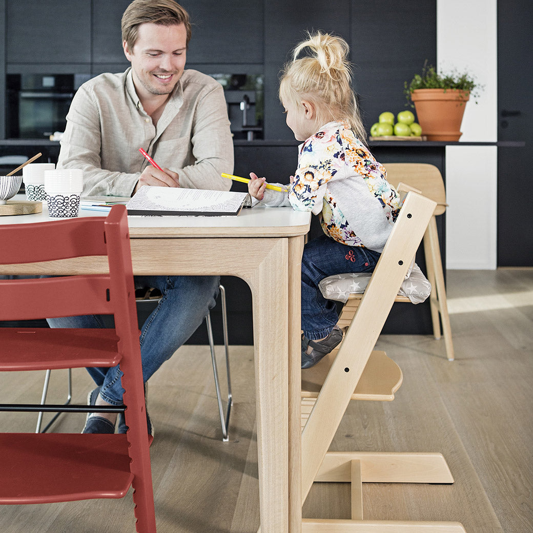 Toddler doing homework with dad sitting in the Tripp Trapp High Chair + Cushion & Tray Bundle in -- Lifestyle
