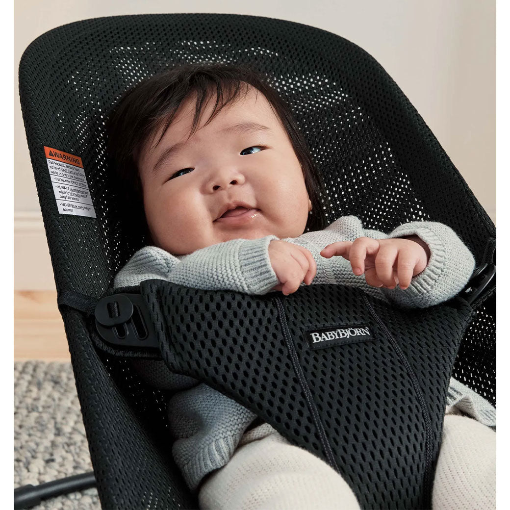 Closeup of baby in BABYBJÖRN Bouncer Bliss in -- Color_Black Mesh