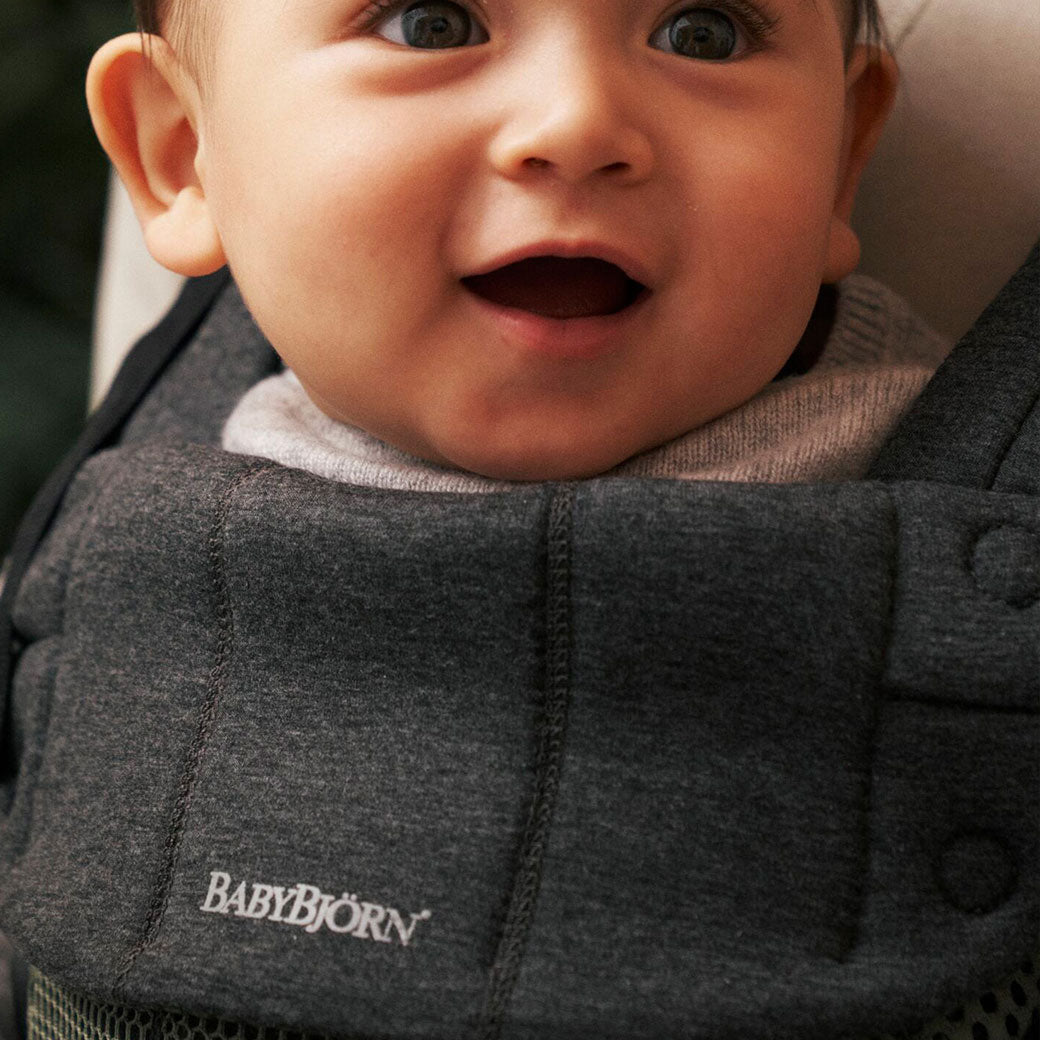Closeup of baby in Babybjorn Baby Carrier Harmony in -- Color_Dark Green