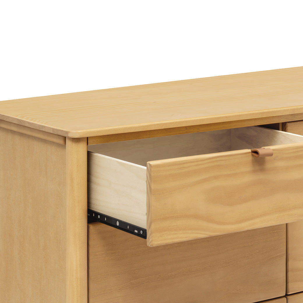 Closeup of an open drawer on the Babyletto Bondi 6-Drawer Dresser in -- Color_Honey