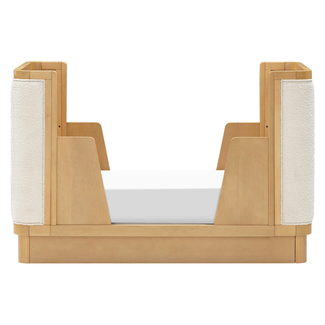 Front view of Babyletto Bondi Boucle 4-in-1 Convertible Crib as toddler bed with the back rail in -- Color_Honey with Ivory Boucle