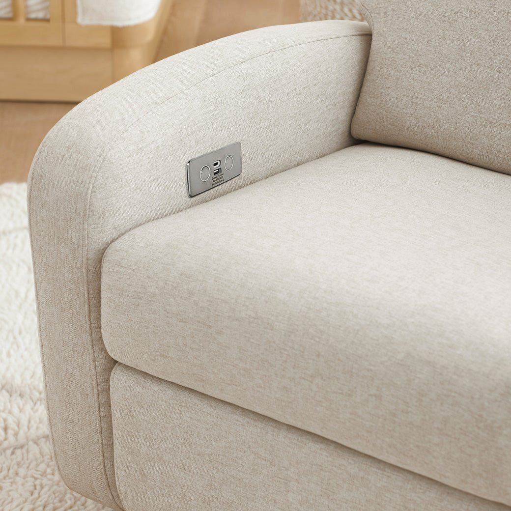 The Babyletto Nami Glider Recliner closeup of the seat in -- Color_Performance Beach Eco-Weave with Light Wood Base