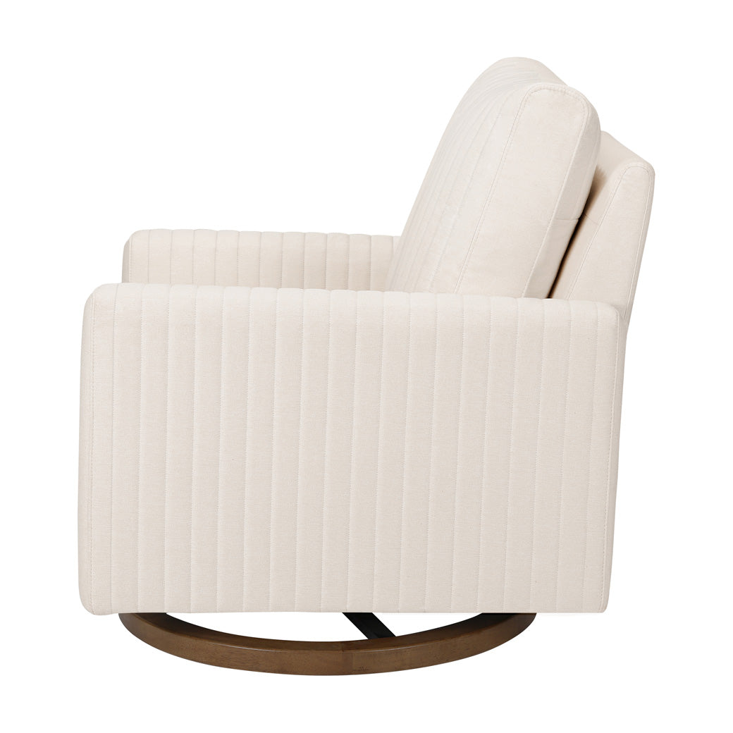 Side view of Babyletto Poe Channeled Swivel Glider in -- Color_Performance Cream Eco-Weave with Dark Wood Base