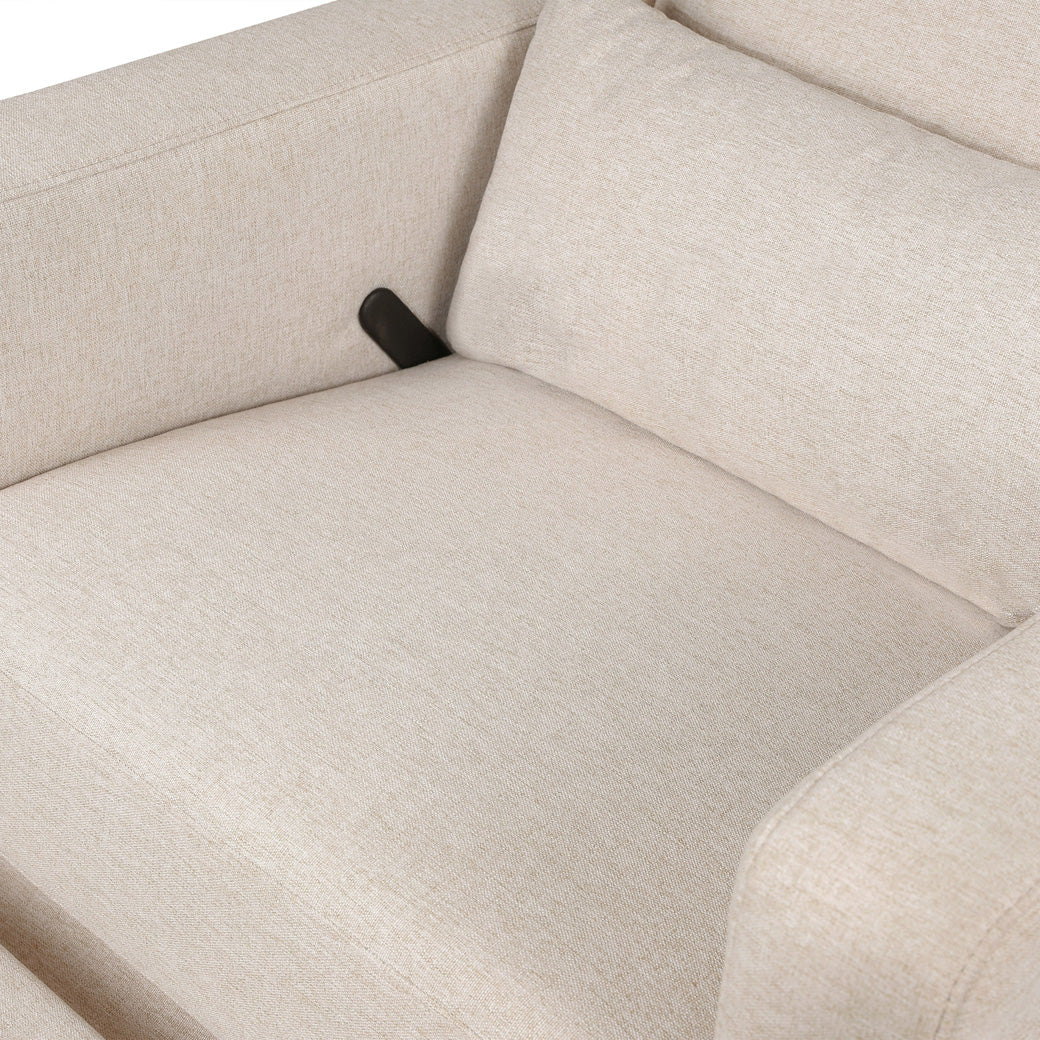 Closeup of the seat opf the Babyletto Sigi Glider Recliner in -- Color_Performance Beach Eco-Weave with Light Wood Base