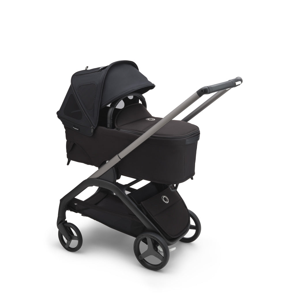 Bugaboo Dragonfly Breezy Sun Canopy open on a bassinet in -- Color_Midnight Black