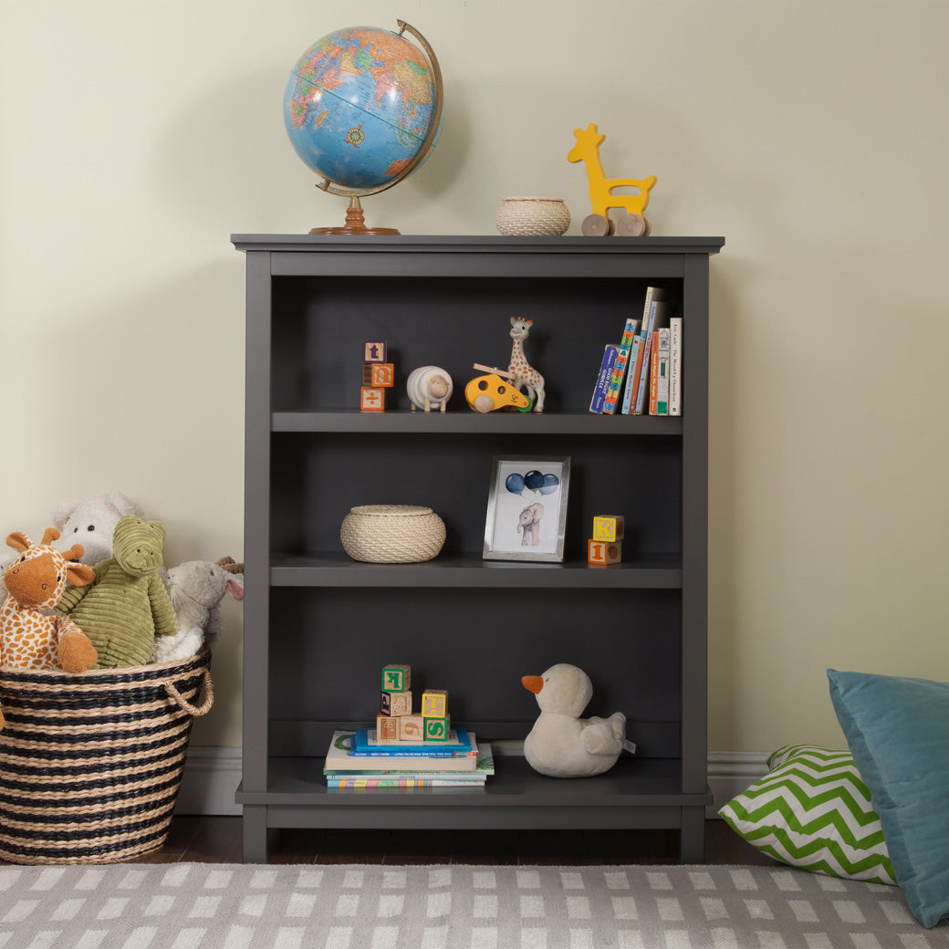 Front view of DaVinci Autumn Bookcase/Hutch with toys and items on shelves in -- Color_Slate