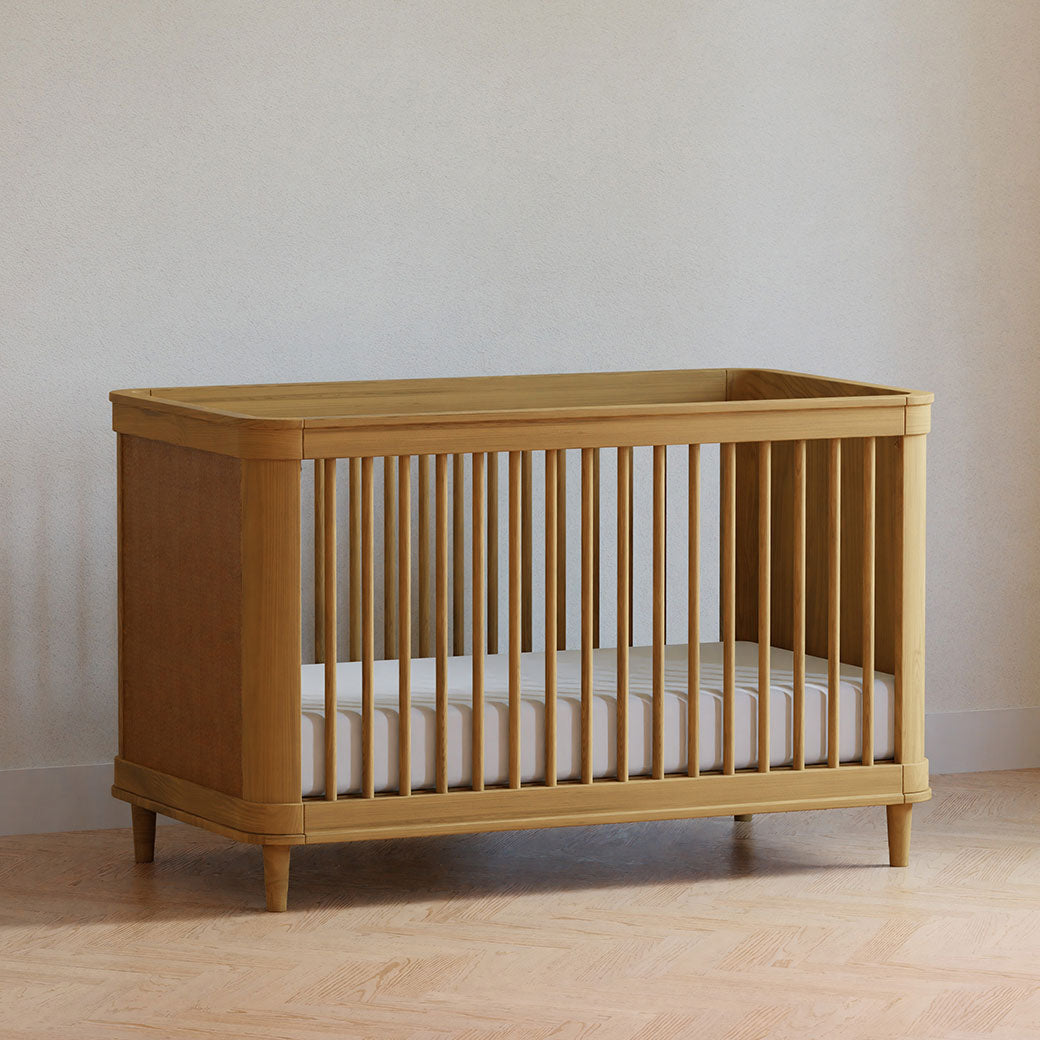The Namesake Marin 3-in-1 Convertible Crib in a room  in -- Color_Honey/Honey Cane