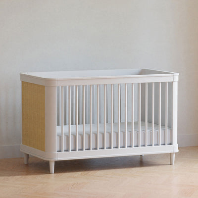 The Namesake Marin 3-in-1 Convertible Crib in a room in -- Color_Warm White/Honey Cane