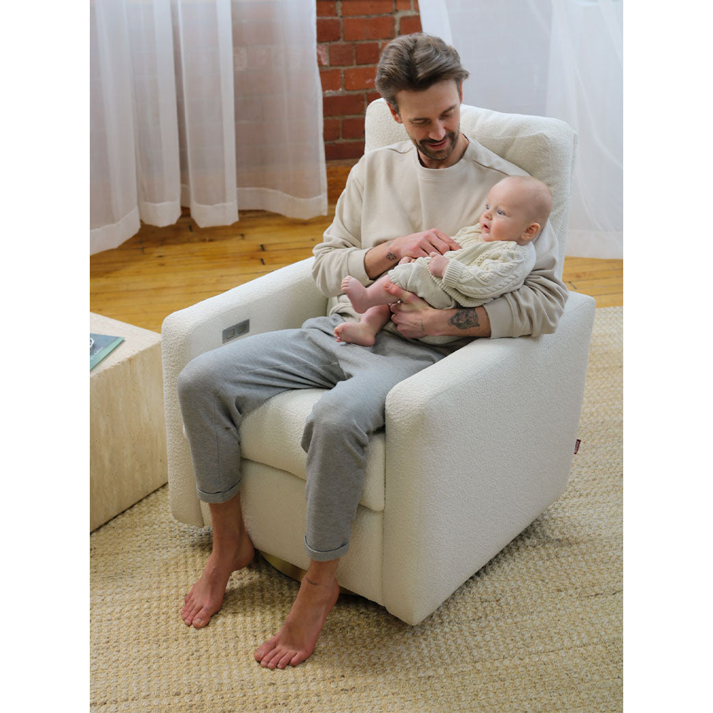 Dad sitting with baby in Monte Matera Glider Recliner in -- Lifestyle