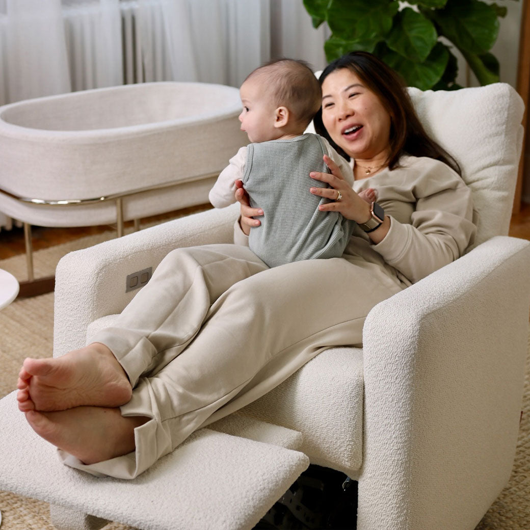 Mom with baby sitting in Monte Matera Glider Recliner in -- Lifestyle