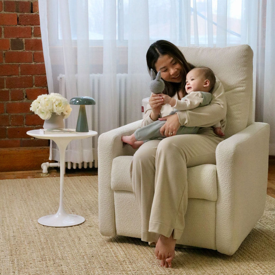 Mom showing toy to baby in Monte Matera Glider Recliner in -- Lifestyle