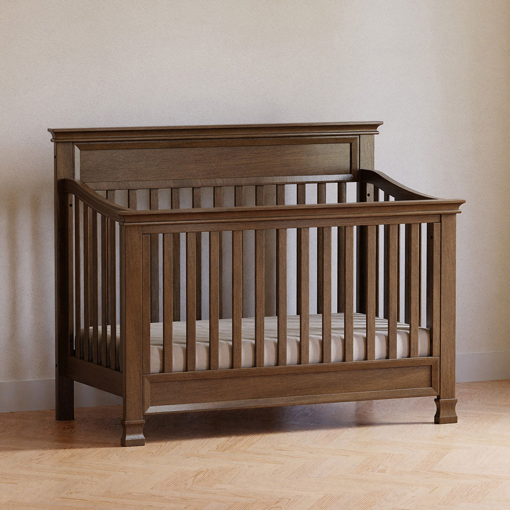 Namesake's Foothill 4-in-1 Convertible Crib in a room against the wall  in -- Color_Mocha