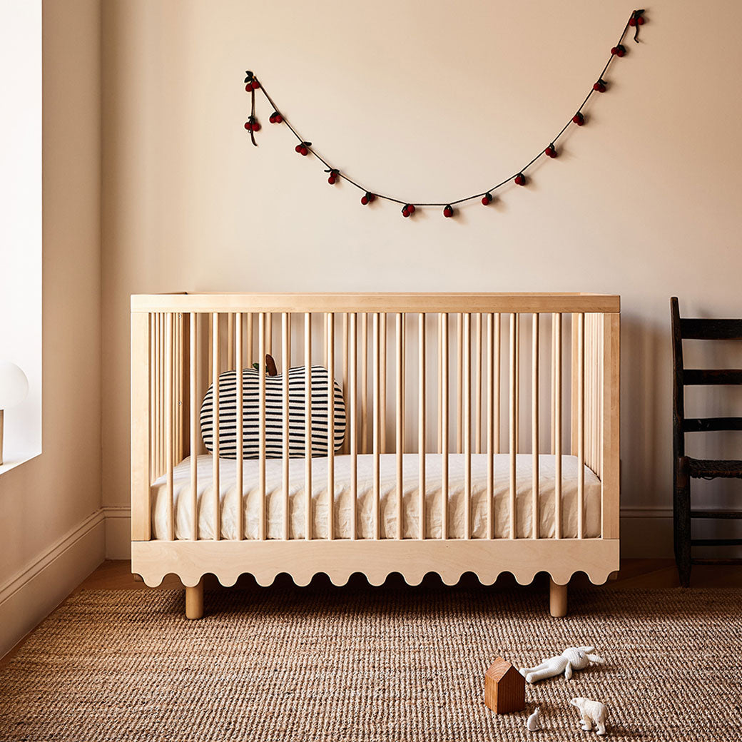 Front view of Oeuf Moss Crib with pillow in -- Color_Birch