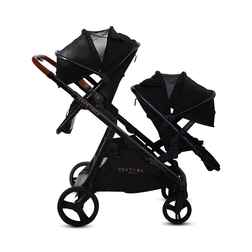 Side view of Venice Child Ventura Single to Double Sit-and-Stand Stroller & 2nd Toddler Seat with canopies down in -- Color_Midnight