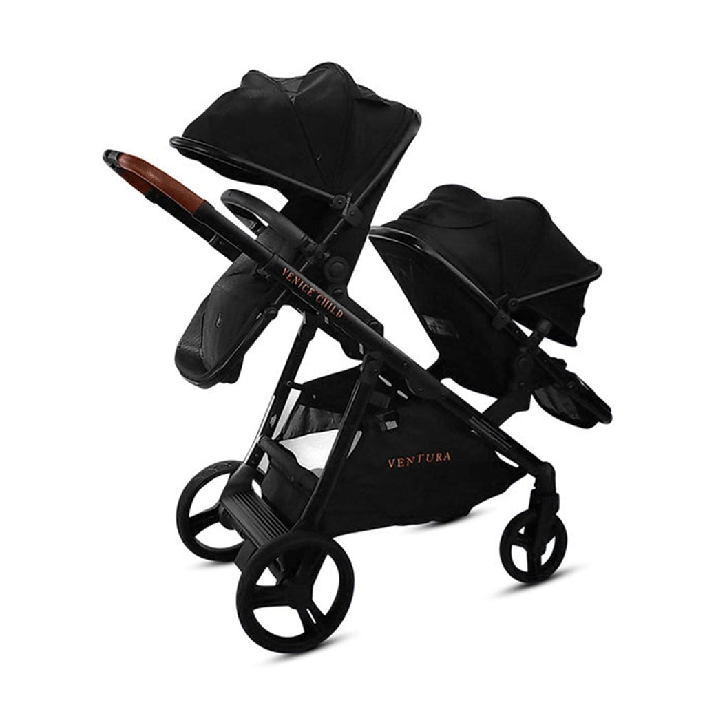 Angled view of Venice Child Ventura Single to Double Sit-and-Stand Stroller & 2nd Toddler Seat with canopies down in -- Color_Midnight