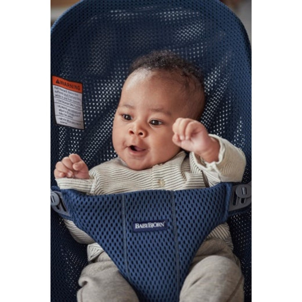 Closeup of baby in BABYBJÖRN Bouncer Bliss in -- Color_Navy Blue Mesh