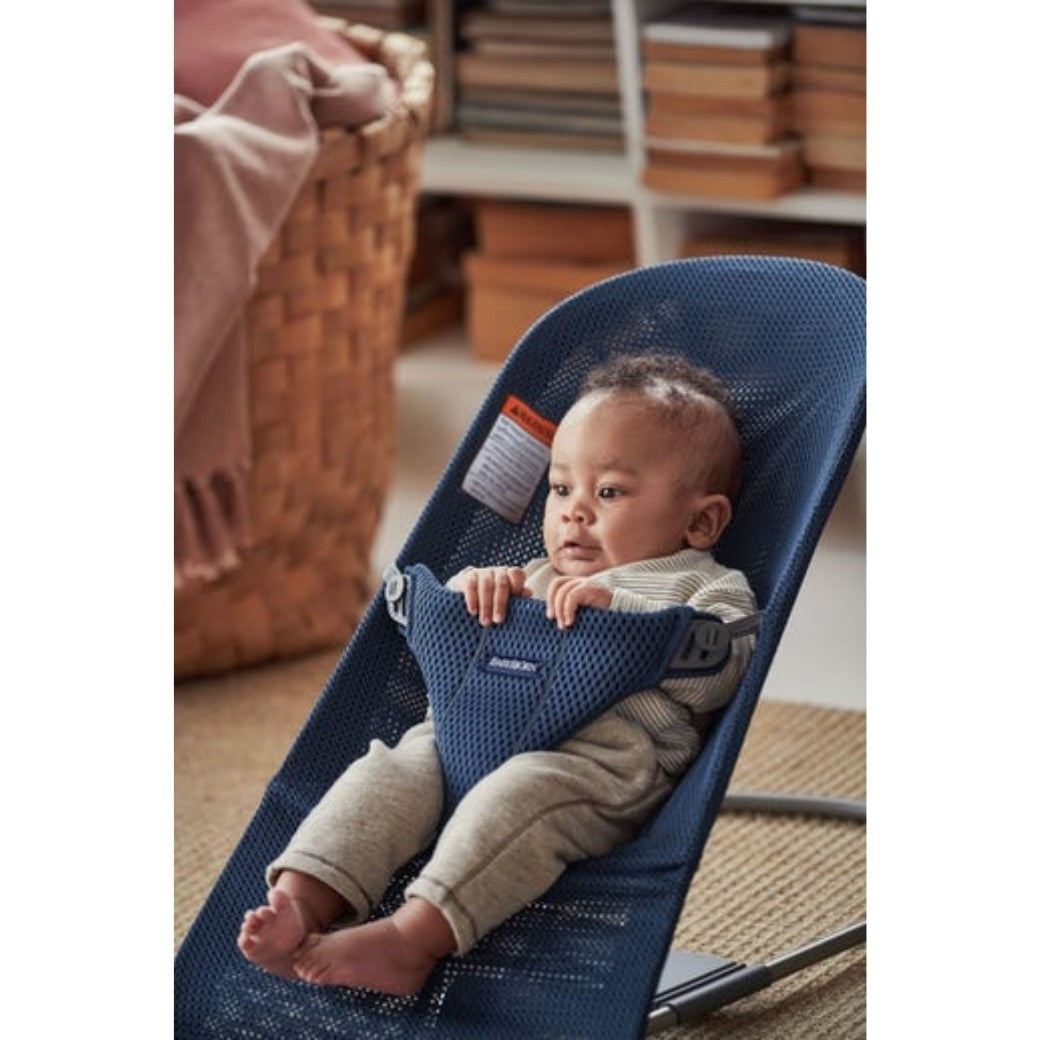 Baby sitting in the BABYBJÖRN Bouncer Bliss in -- Color_Navy Blue Mesh