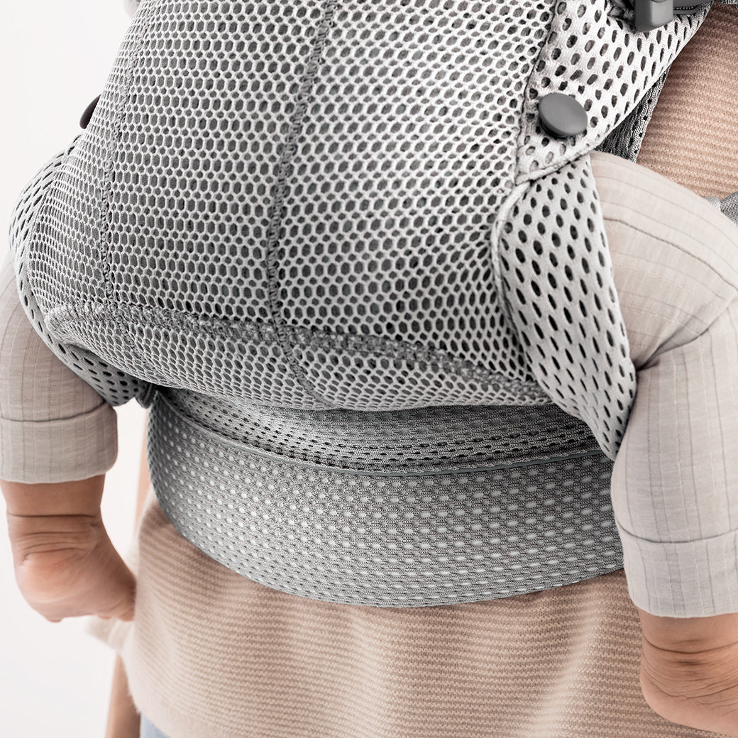 Closeup of back Babybjorn Baby Carrier Harmony with baby inside in -- Color_Silver