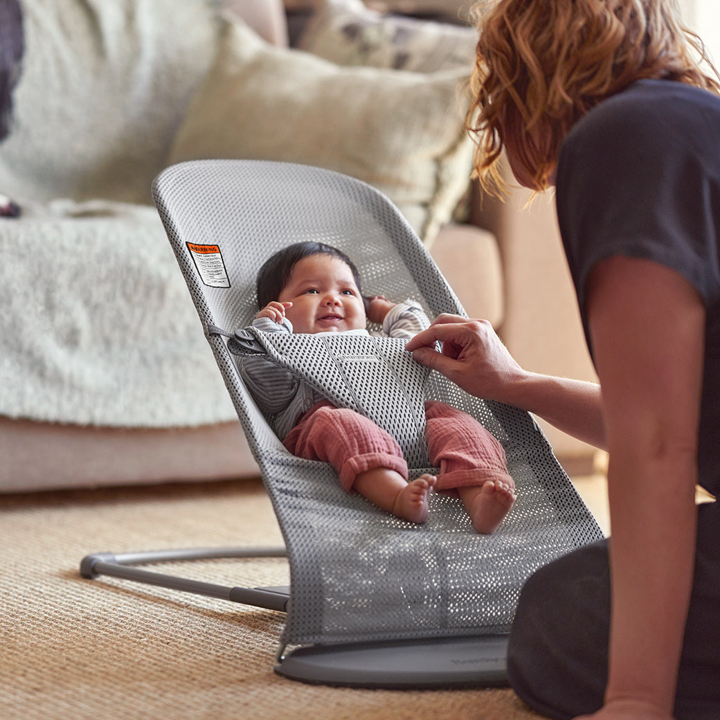 Parent looking at baby in BABYBJÖRN Bouncer Bliss in -- Color_Grey Mesh
