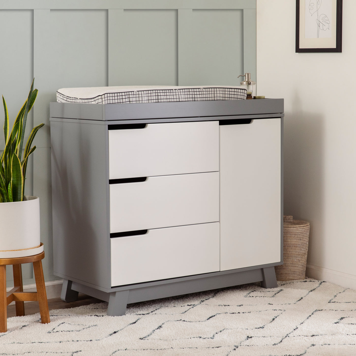 Lifestyle side view of The Babyletto Hudson Changer Dresser in -- Color_White/Grey