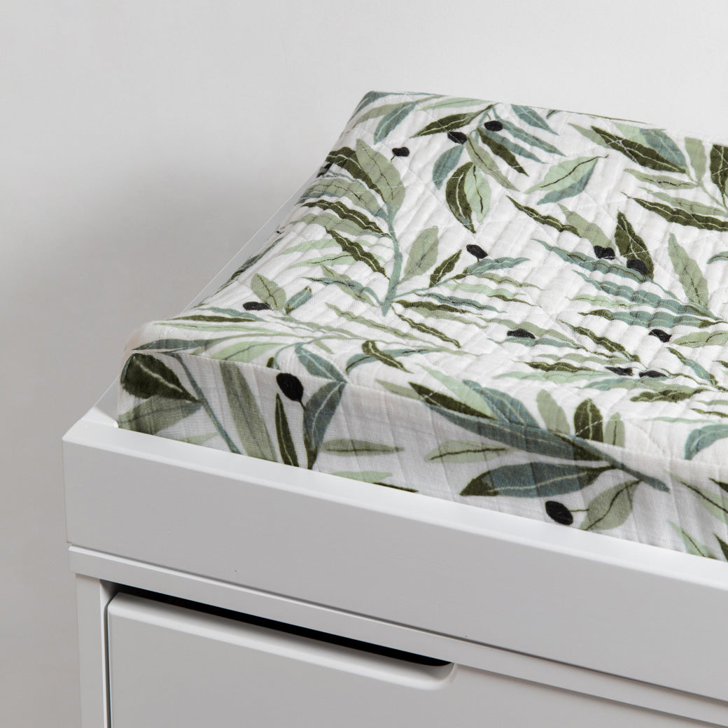 Babyletto Quilted Changing Pad Cover In GOTS Certified Organic Muslin Cotton in a changing tray in -- Color_Olive Branches