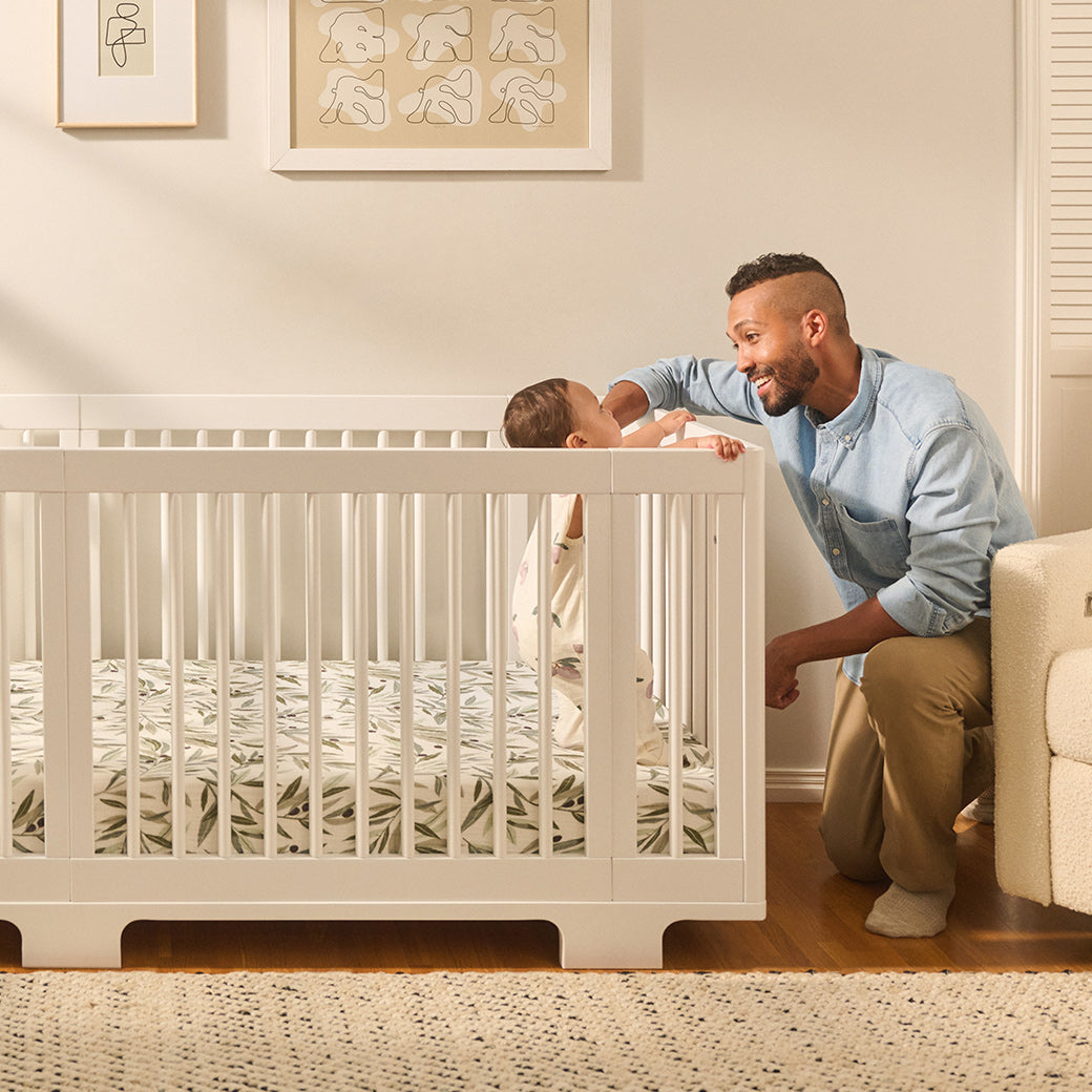 Father with baby with Babyletto's Yuzu 8-In-1 Convertible Crib in -- Color_White