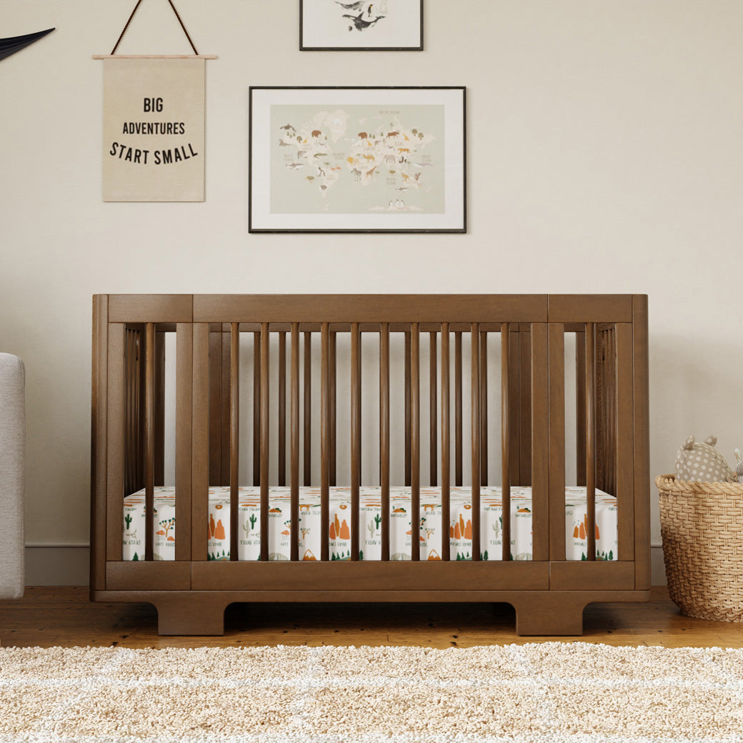 Front view of Babyletto's Yuzu 8-In-1 Convertible Crib in a room in -- Color_Natural Walnut