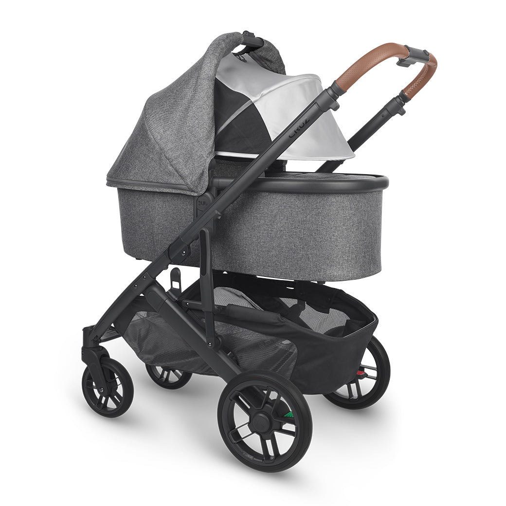 Reversed bassinet with sunshade down on UPPAbaby Cruz V2 Stroller in -- Color_Gregory
