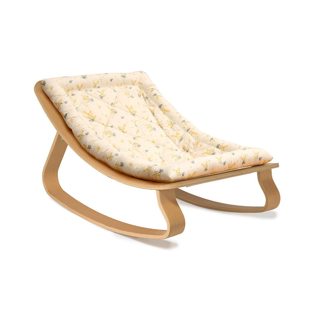 Side view of Charlie Crane LEVO Baby Rocker without harness in -- Color_Garbo And Friends Mimosa _ Beech