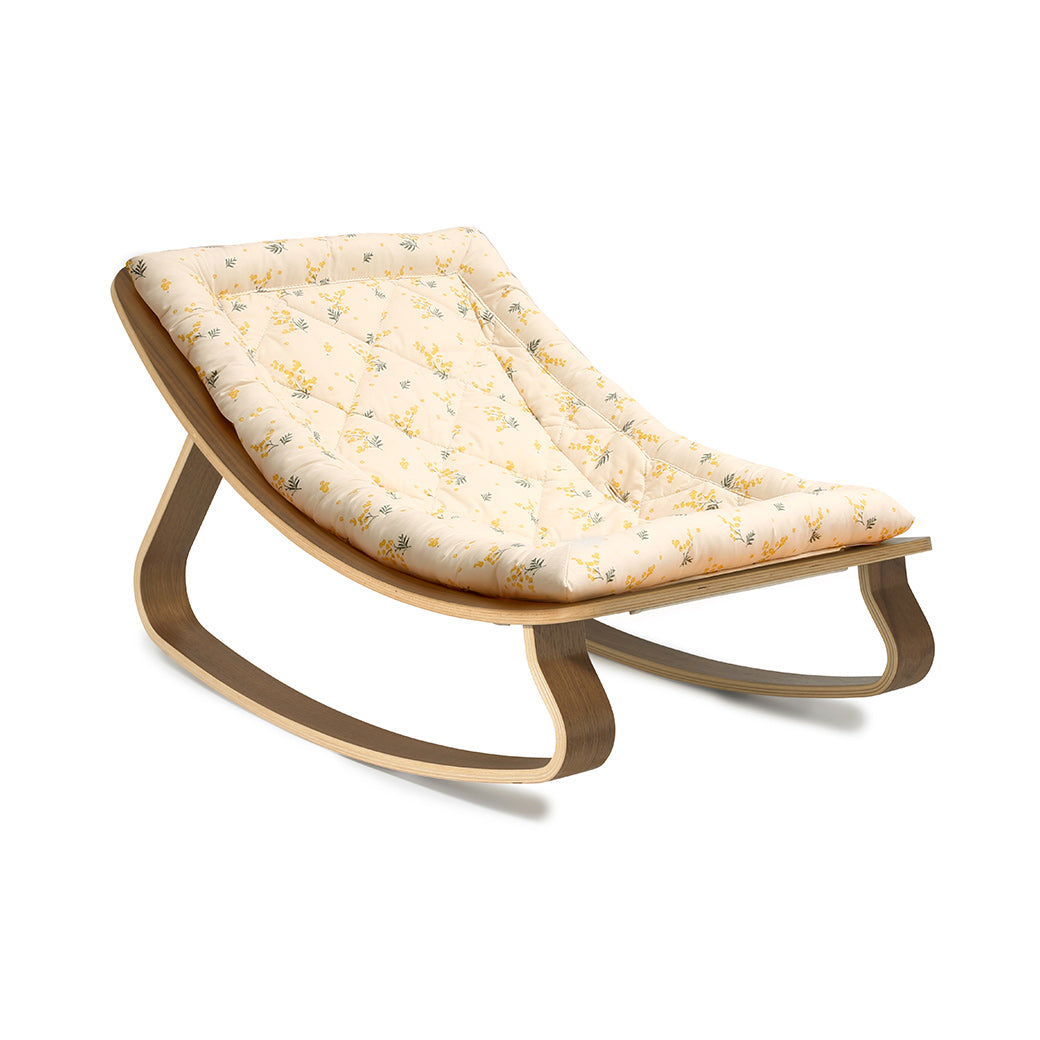 Side view of Charlie Crane LEVO Baby Rocker without harness  in -- Color_Garbo And Friends Mimosa _ Walnut
