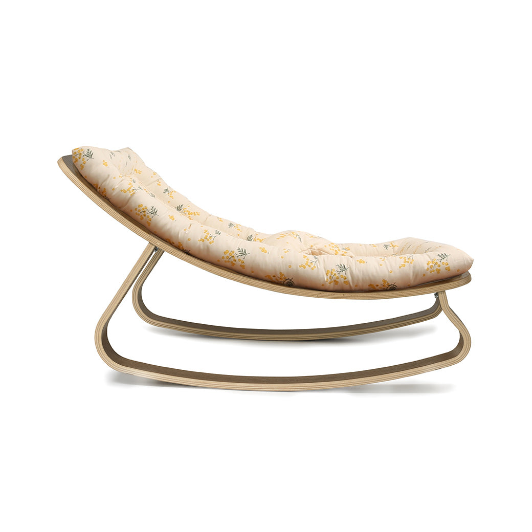 Profile view of Charlie Crane LEVO Baby Rocker in -- Color_Garbo And Friends Mimosa _ Walnut