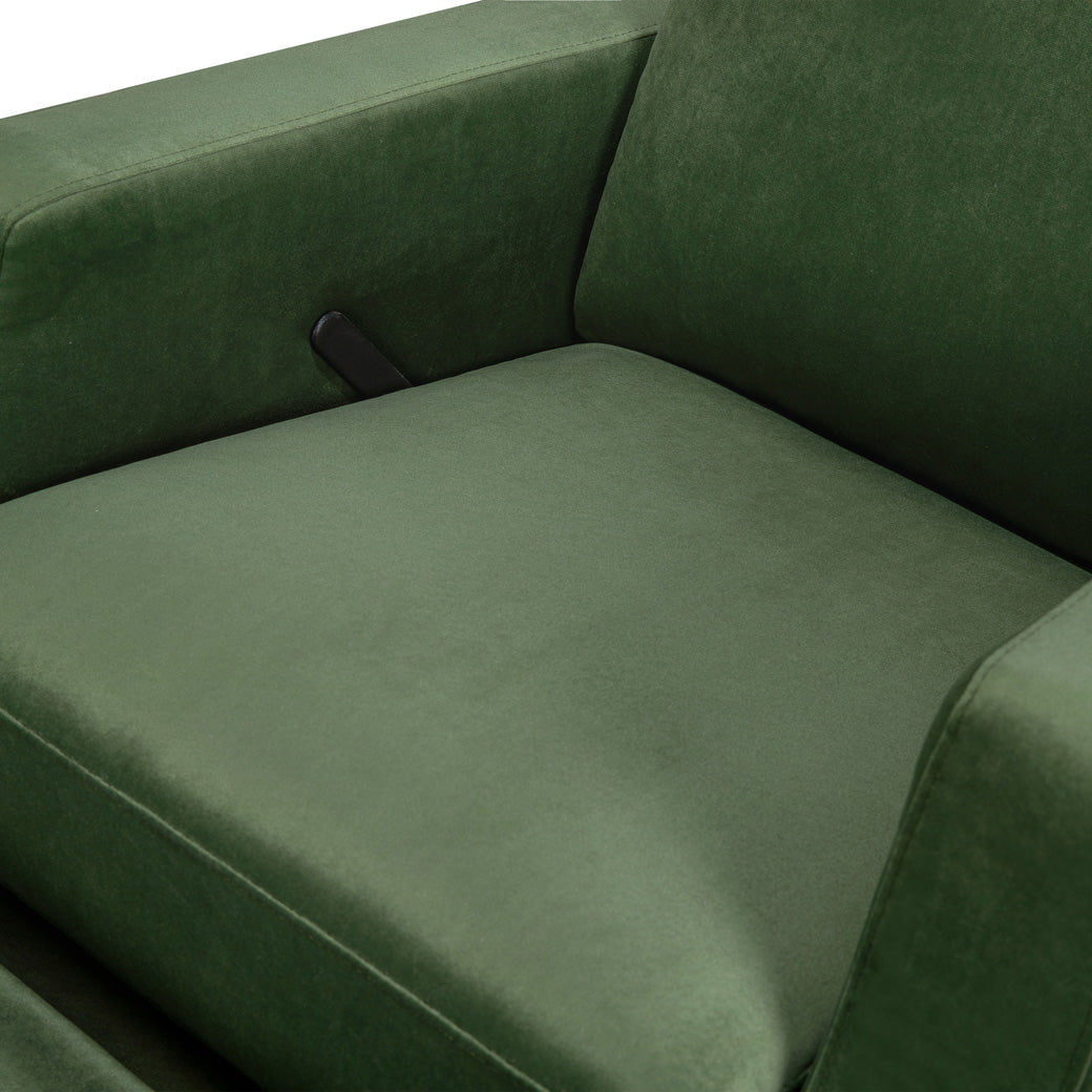 Closeup of the seat of Crewe Recliner & Swivel Glider in -- Color_Forest Green Velvet With Light Wood Base