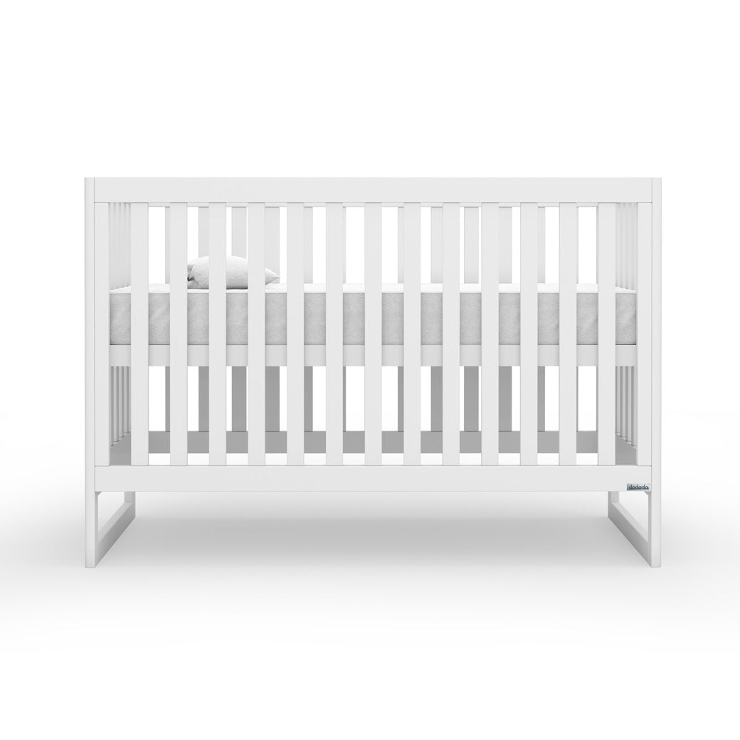 Front view of Dadada Austin 3-in-1 Crib with mattress on top  in -- Color_White