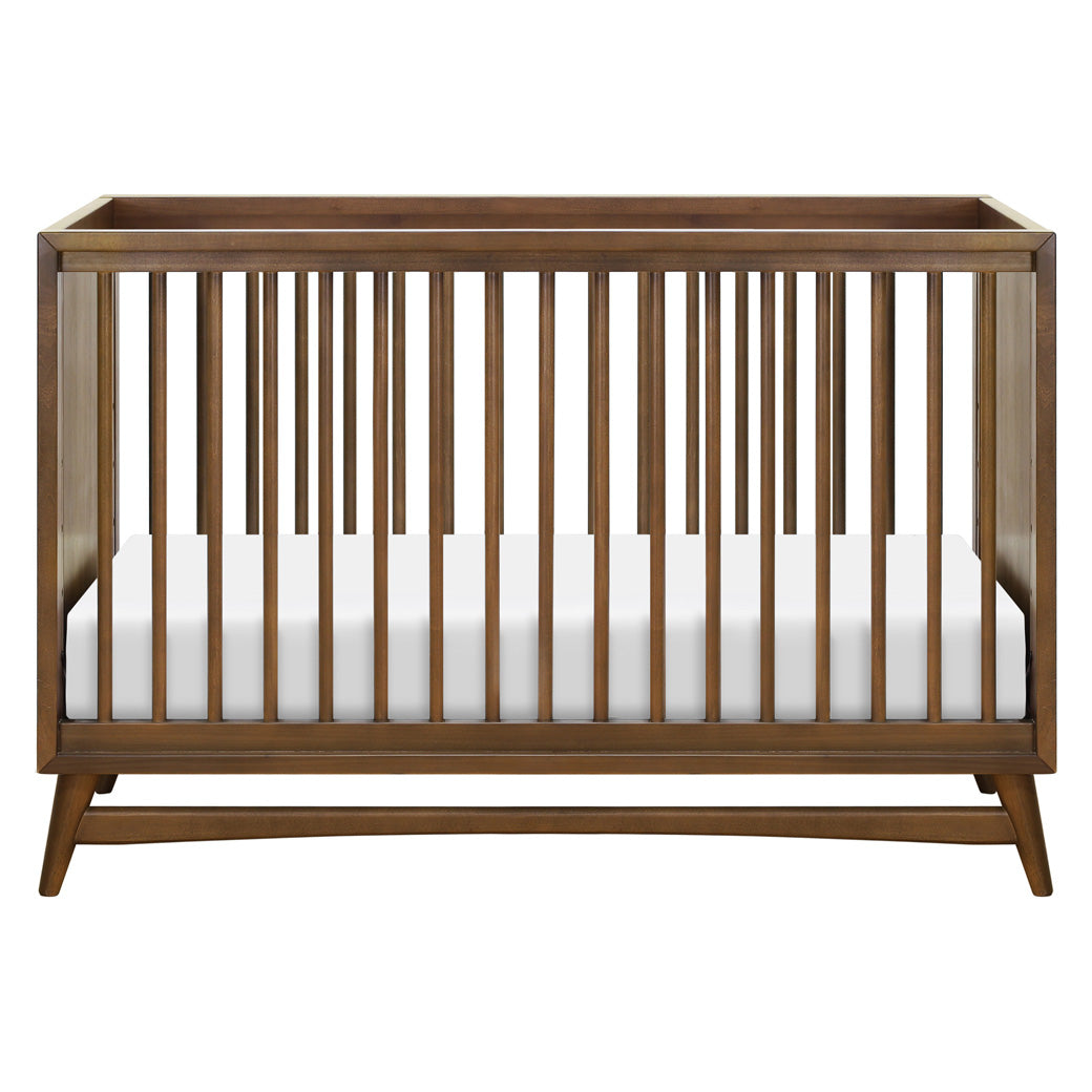 Front view of Babyletto's Peggy 3-in-1 Convertible Crib in -- Color_Natural Walnut