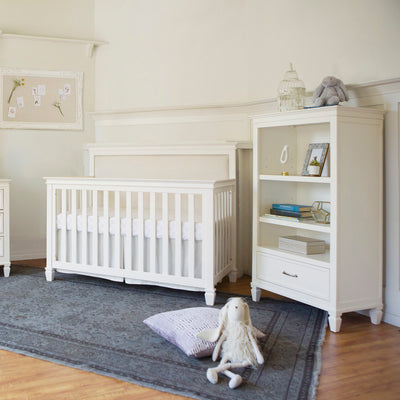 Namesake's Darlington Bookcase in Warm White in a nursery next to a crib