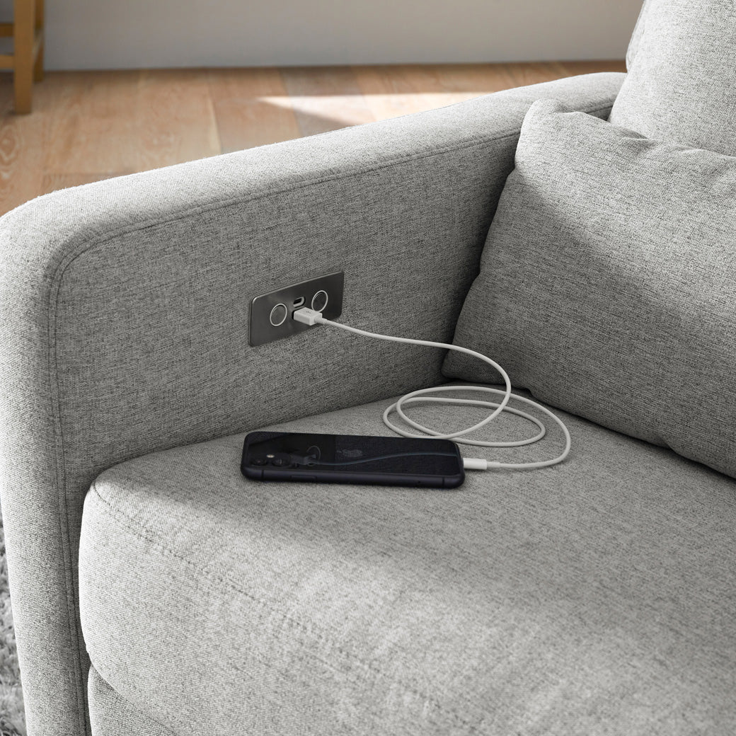 Babyletto Sigi Electronic Glider Recliner with a phone charging on the USB port in -- Color_Performance Grey Eco-Weave