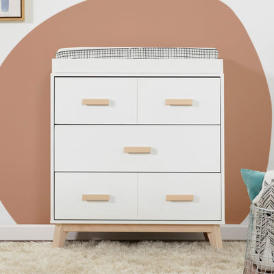Front view of Babyletto's Scoot 3-Drawer Changer Dresser in a room  in -- Color_Washed Natural/White