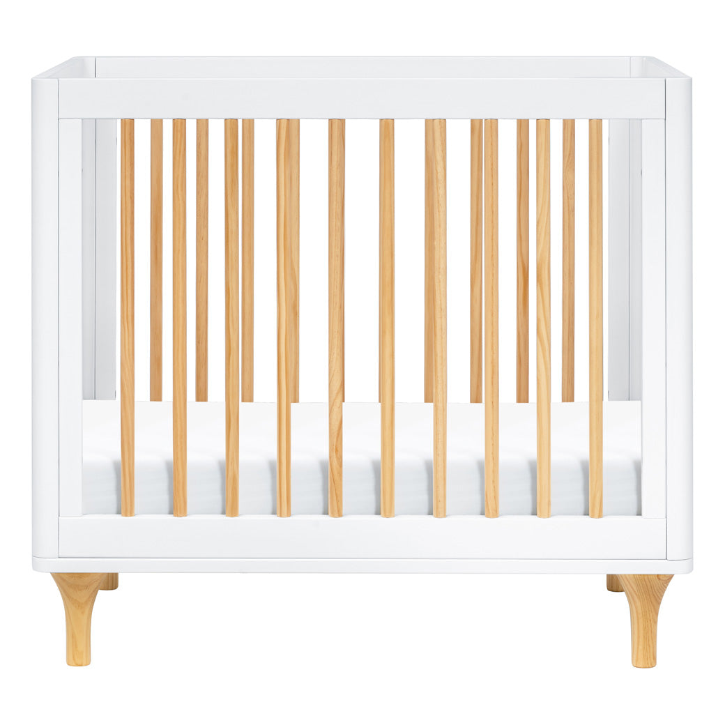 Front view of The Babyletto Lolly 4-in-1 Convertible Mini Crib in -- Color_White / Natural
