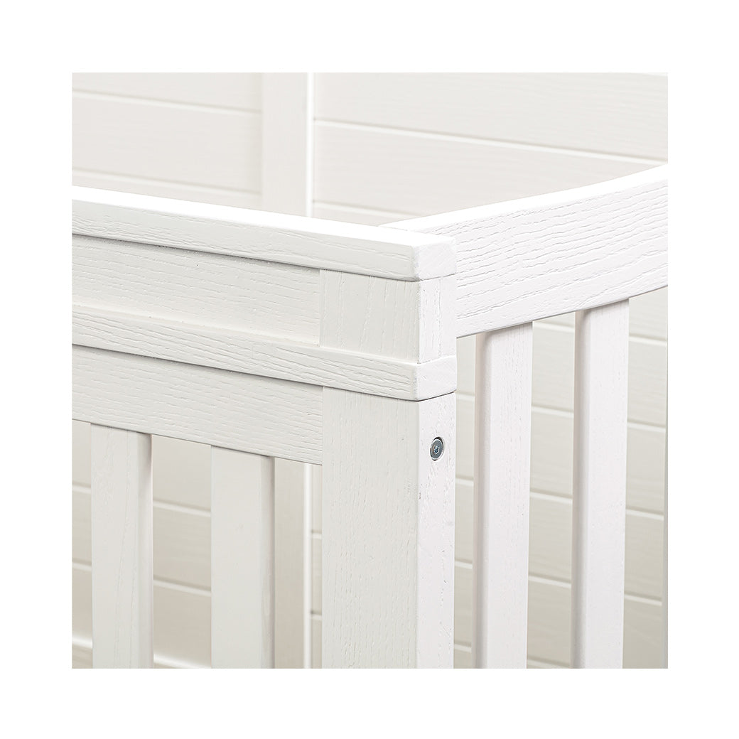 Detail of Namesake's Wesley Farmhouse 4-in-1 Convertible Storage Crib in -- Color_Heirloom White