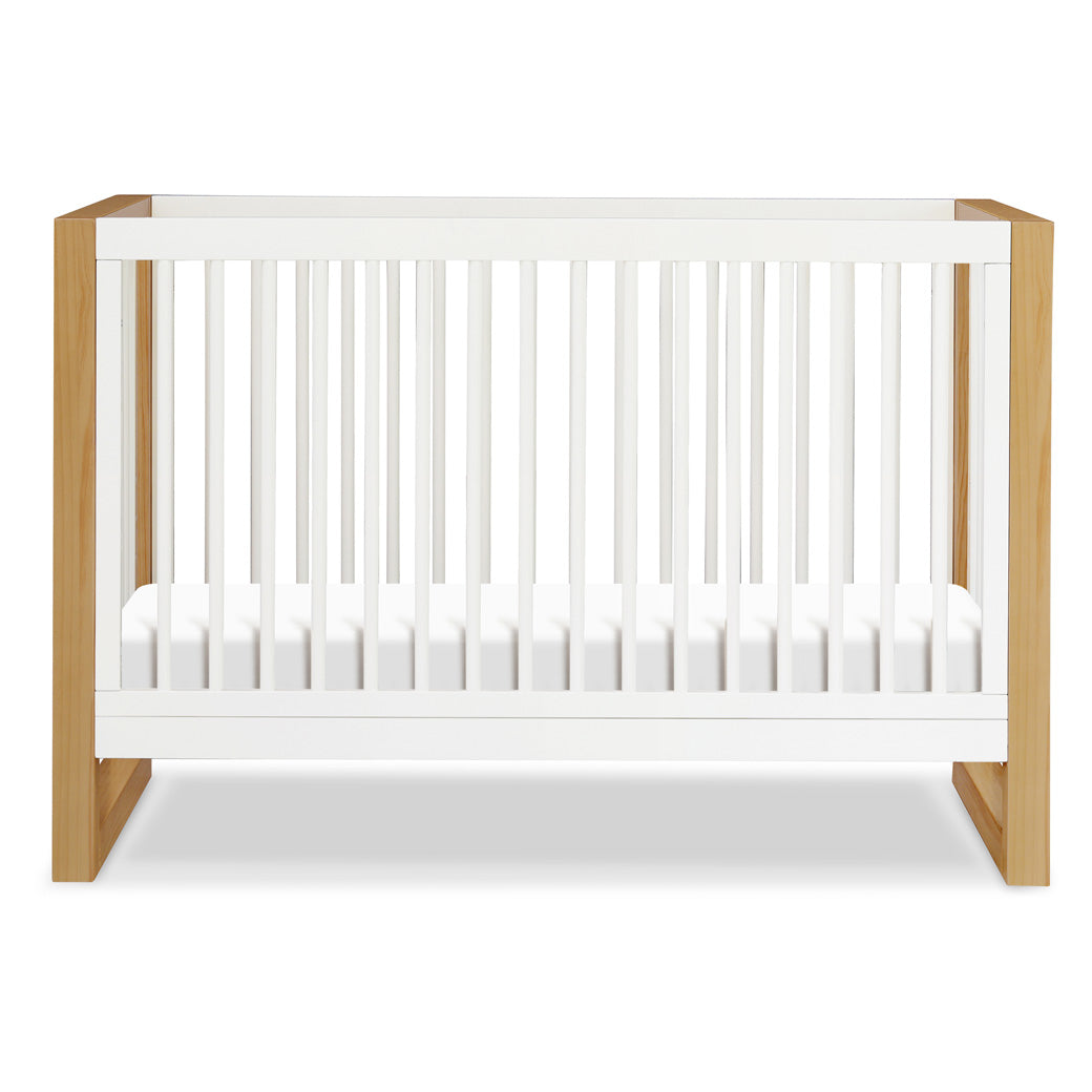 Front view of Namesake's Nantucket 3-in-1 Convertible Crib in -- Color_Warm White/Honey