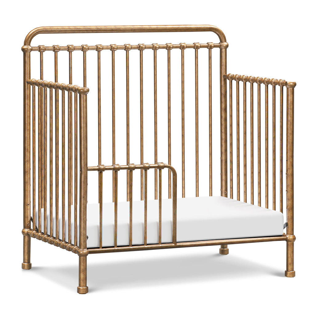 Namesake's Winston 4-in-1 Convertible Mini Crib as toddler bed in -- Color_Vintage Gold
