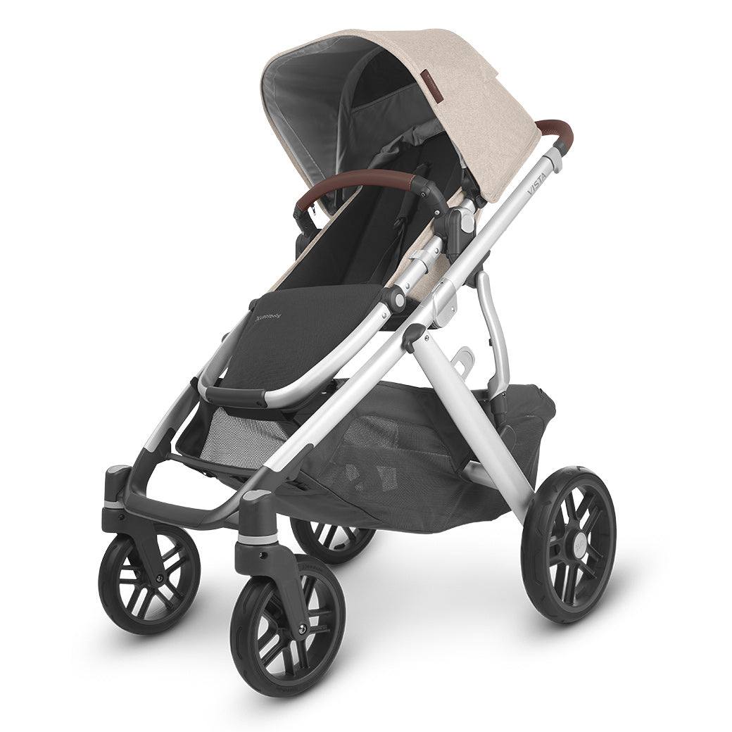 The half extended sunshade on right side view of the uppababy vista v2 stroller -- Color_Declan