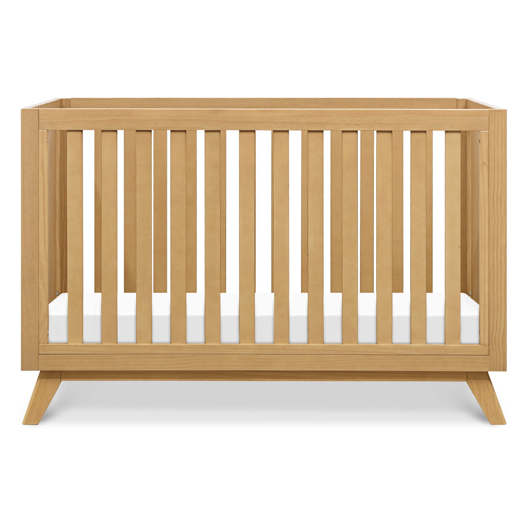 Front view of DaVinci Otto 3-in-1 Convertible Crib in -- Color_Honey _ Wood