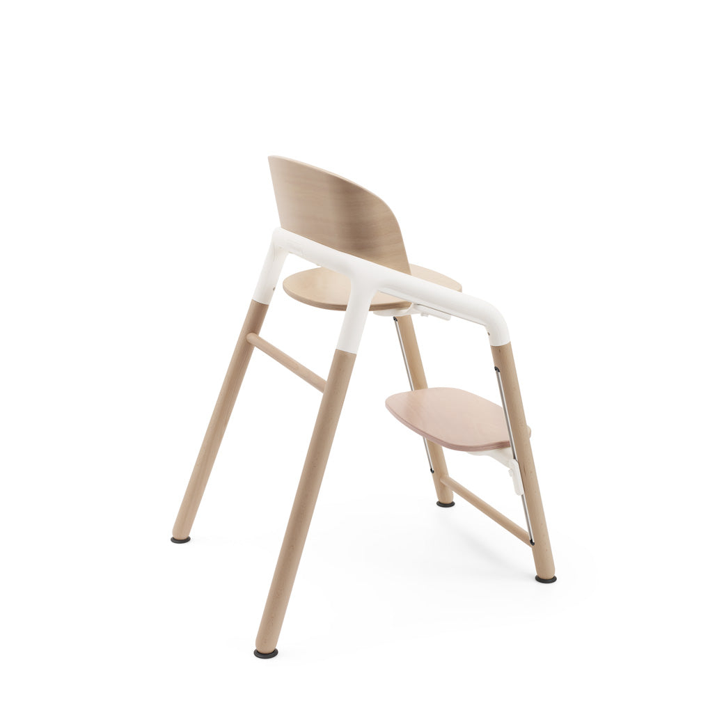 Side corner view of Bugaboo Giraffe High Chair in --Color_Neutral Wood / White