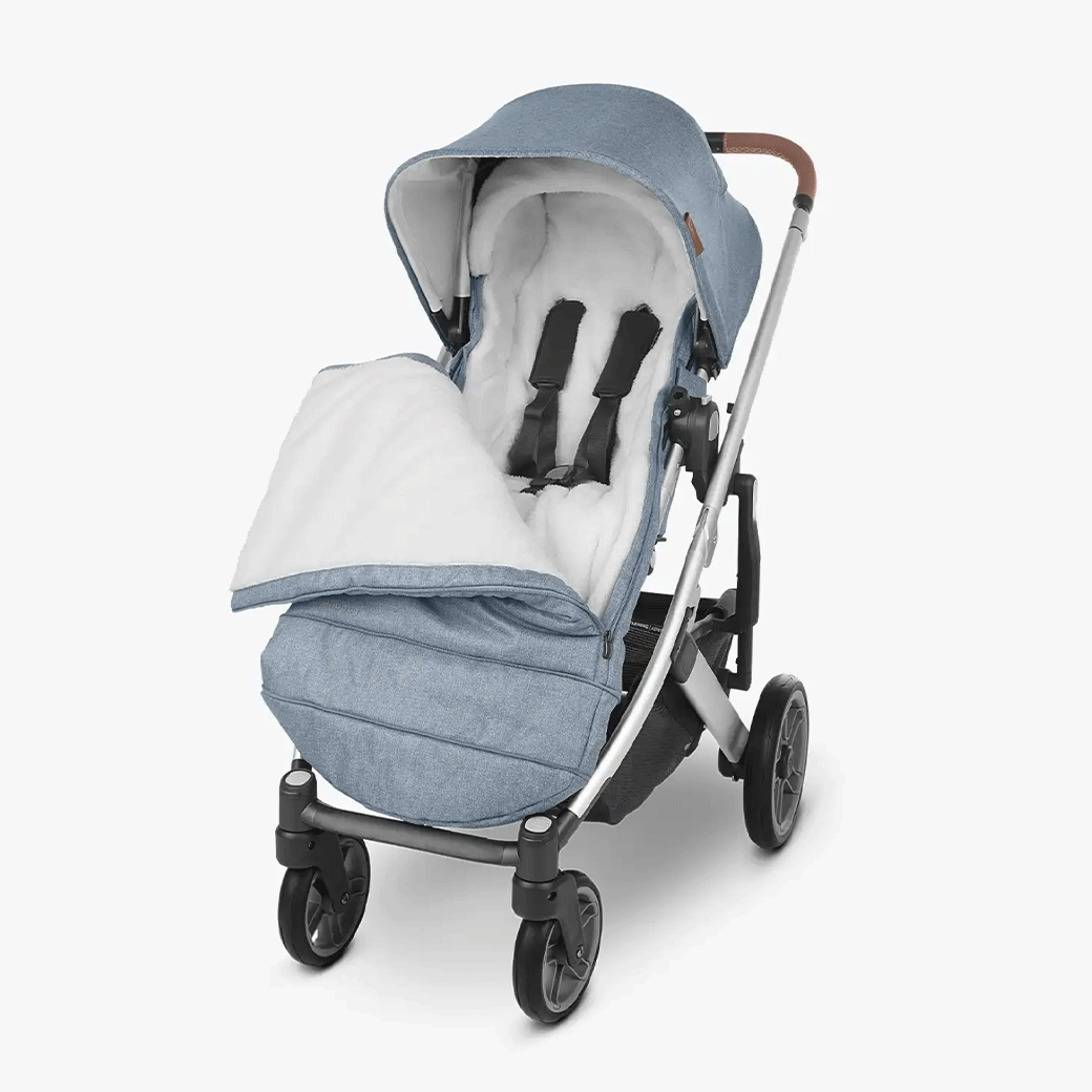 the ultra-plush CozyGanoosh footmuff putting on the light blue stroller showing inner fluffy side-- Color_Gregory