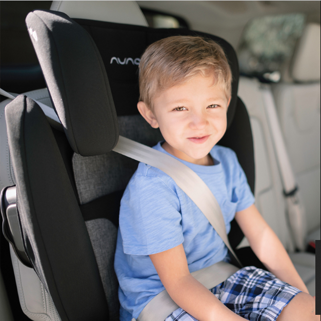A child in Nuna AACE Booster Seat in -- Color_Caviar