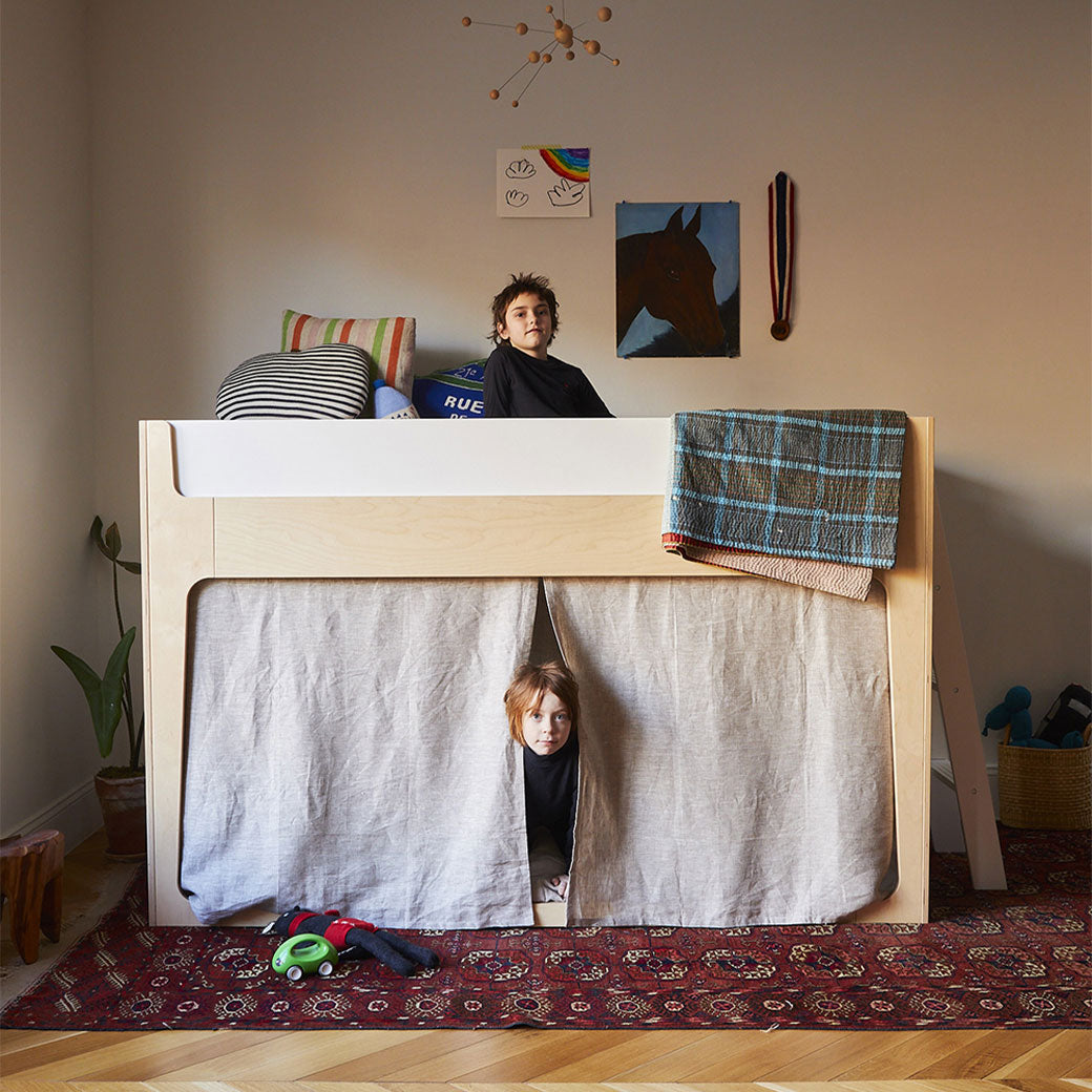 Lifestyle view of Oeuf Perch Nest Bed with one child on top and one child bellow