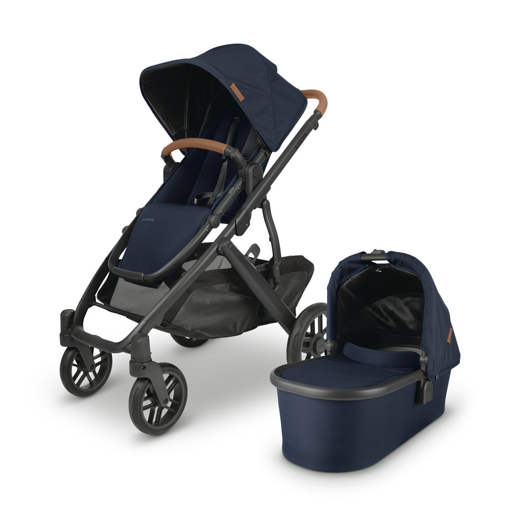 The all-new UPPAbaby VISTA v2 in dark blue accommpanied by its matching bassinet -- Color_Noa