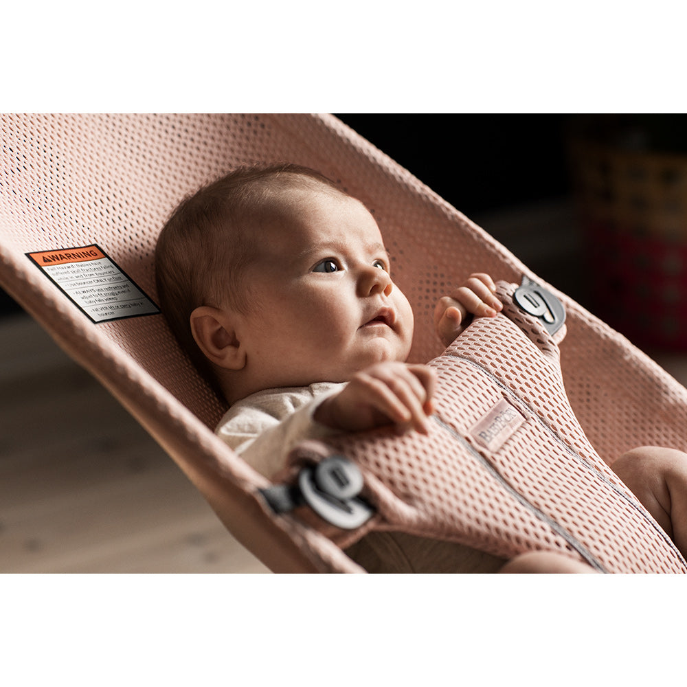 Baby sitting in BABYBJÖRN Bouncer Bliss in -- Color_Pearly Pink Mesh